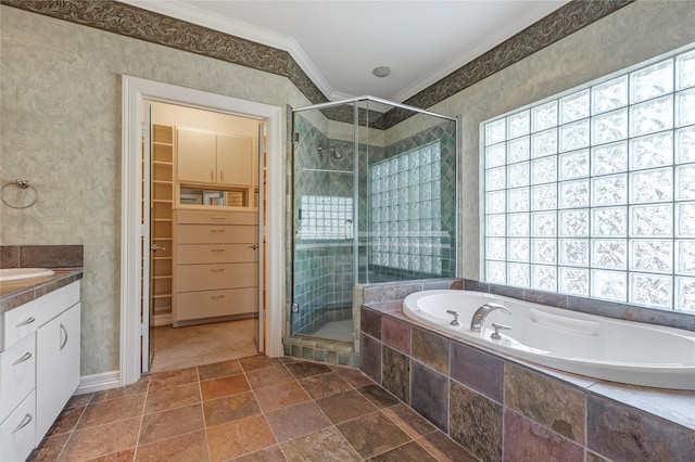 full bath featuring a garden tub, a spacious closet, a shower stall, and crown molding