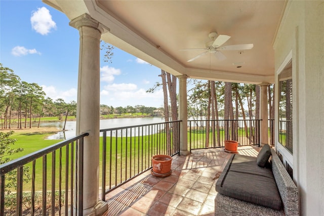 exterior space with a water view and a ceiling fan