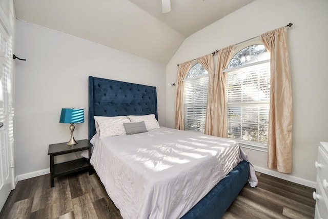 bedroom featuring baseboards, wood finished floors, a ceiling fan, and vaulted ceiling