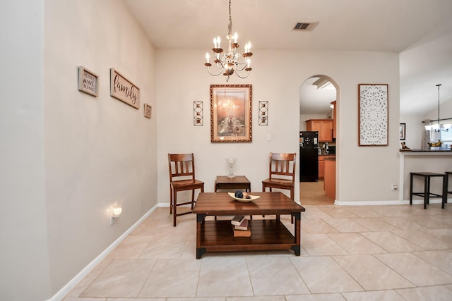 living area with light tile patterned floors, visible vents, baseboards, arched walkways, and a notable chandelier