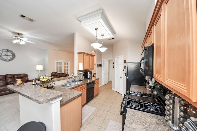 kitchen with visible vents, black appliances, a sink, open floor plan, and a peninsula