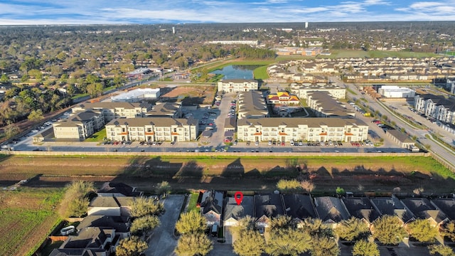 bird's eye view with a residential view and a water view