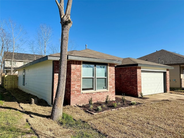 view of front facade featuring brick siding, driveway, and a garage