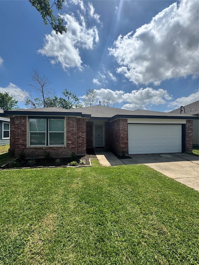 5422 Tommye St, Houston, TX 77028 - single story home with a front lawn, driveway, a garage, and brick siding