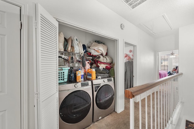 clothes washing area with visible vents, carpet floors, separate washer and dryer, attic access, and laundry area