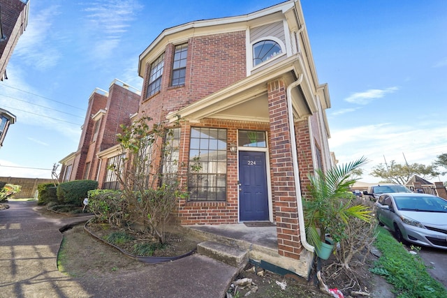 view of front of house with brick siding