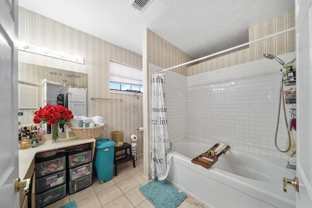 bathroom with wallpapered walls, shower / bathtub combination with curtain, visible vents, and a textured ceiling