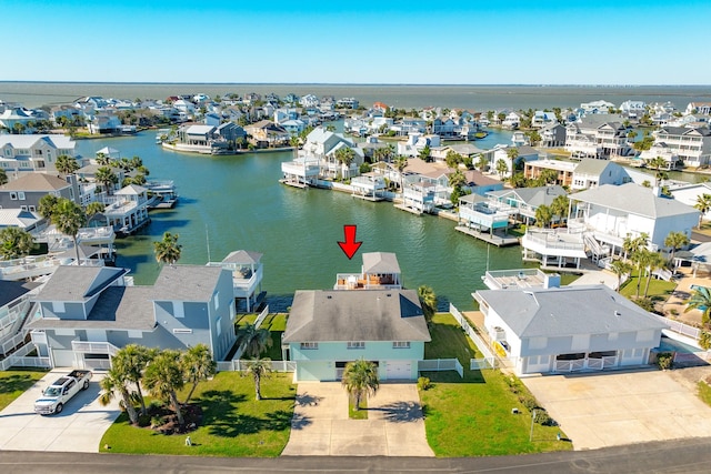 bird's eye view featuring a residential view and a water view