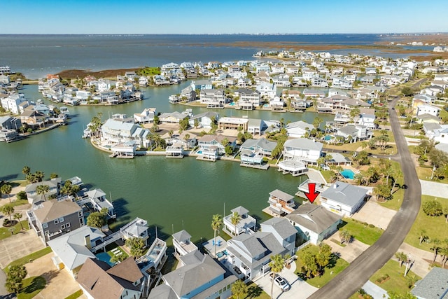 aerial view with a residential view and a water view