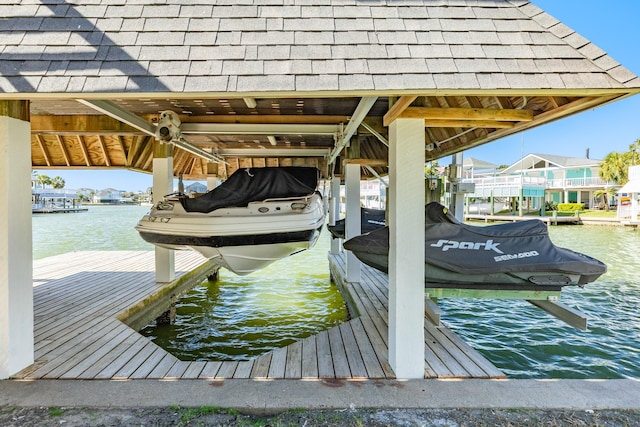 dock area featuring a water view and boat lift