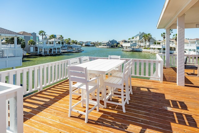 view of dock featuring a residential view and a water view