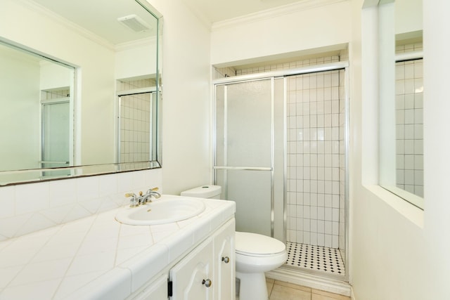 bathroom with a shower stall, toilet, visible vents, and ornamental molding