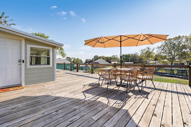 deck featuring outdoor dining area