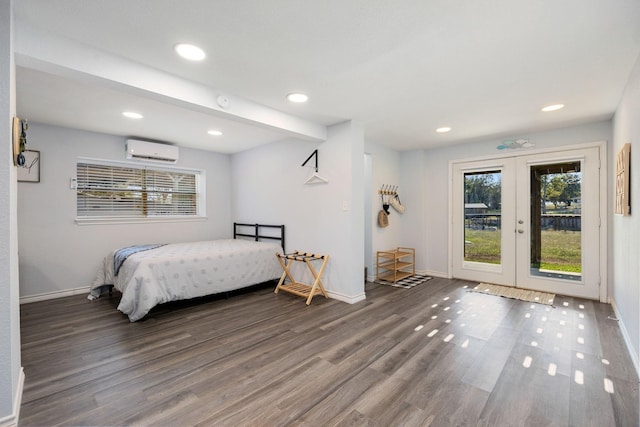 bedroom featuring wood finished floors, a wall unit AC, recessed lighting, baseboards, and access to exterior