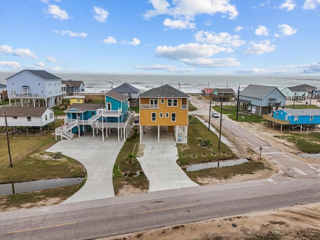 aerial view featuring a residential view and a water view