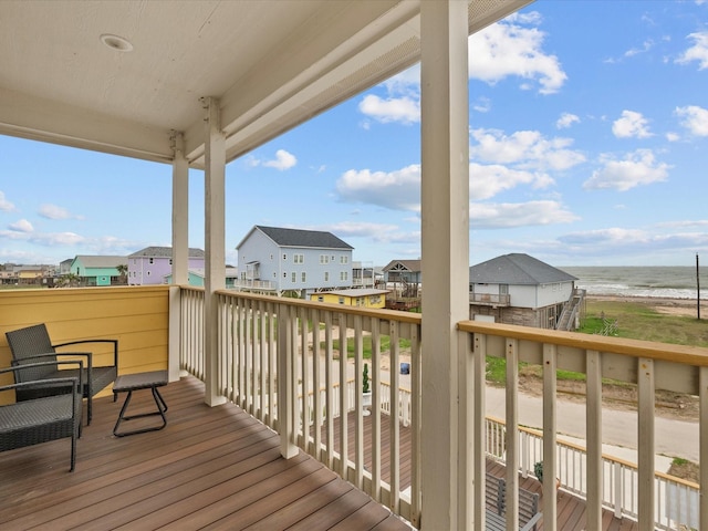 deck with a residential view and a water view