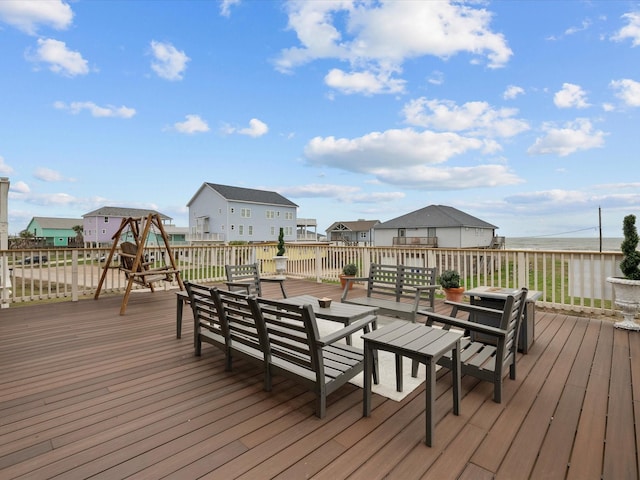 wooden deck featuring a residential view and outdoor lounge area