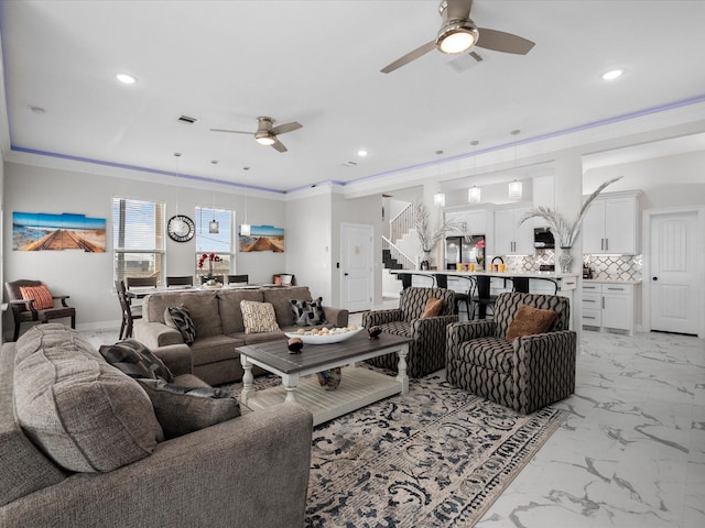 living room featuring recessed lighting, visible vents, marble finish floor, and crown molding