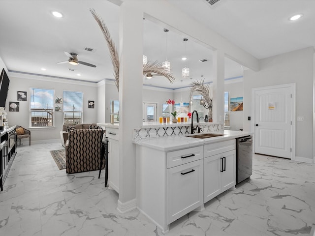 kitchen with crown molding, open floor plan, dishwashing machine, marble finish floor, and a sink