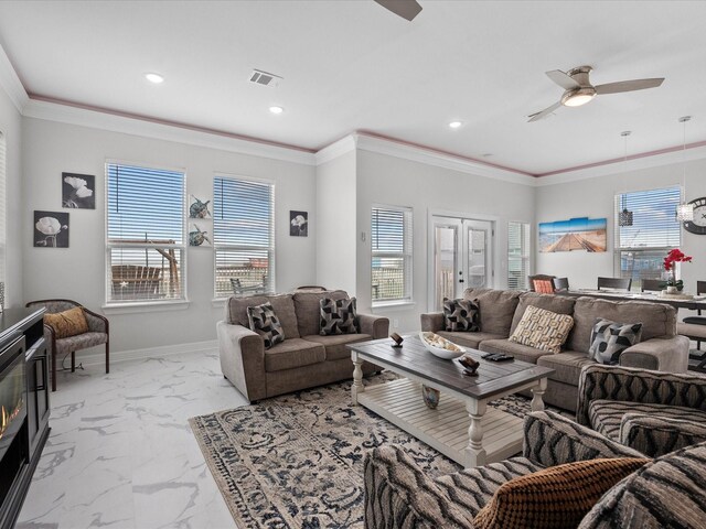 1018 Seashell Dr, Surfside Beach, TX 77541 - living room featuring a ceiling fan, light marble finish flooring, recessed lighting, crown molding, and healthy amount of natural light
