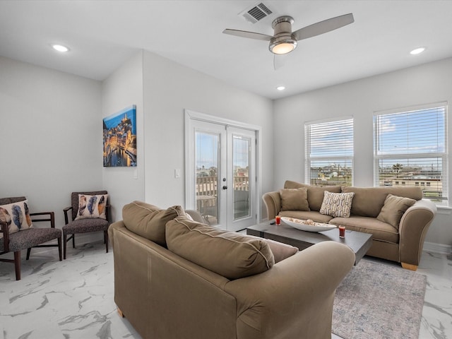 living room featuring visible vents, marble finish floor, french doors, and a healthy amount of sunlight