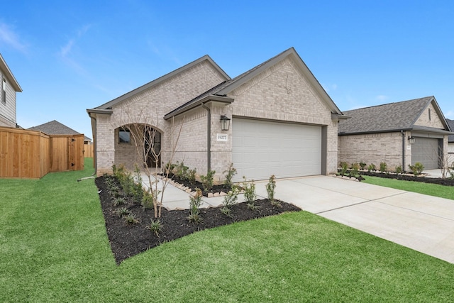 view of front of house with a front lawn, fence, concrete driveway, a garage, and brick siding