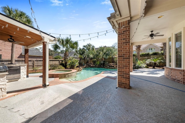 view of patio with a ceiling fan, a fenced backyard, and a pool with connected hot tub