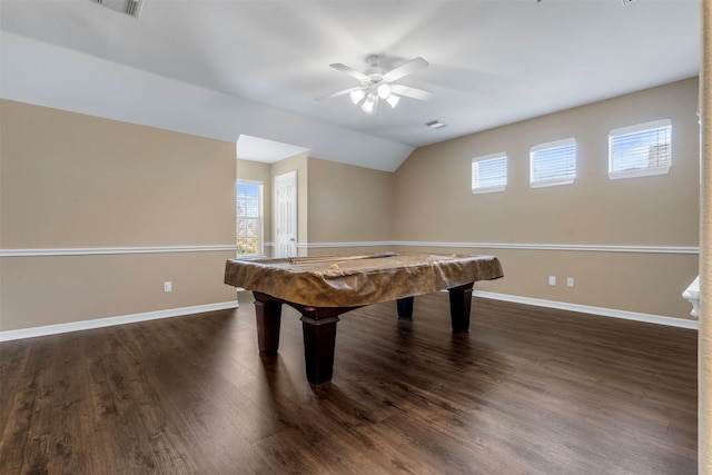 recreation room featuring dark wood-style floors, baseboards, and vaulted ceiling