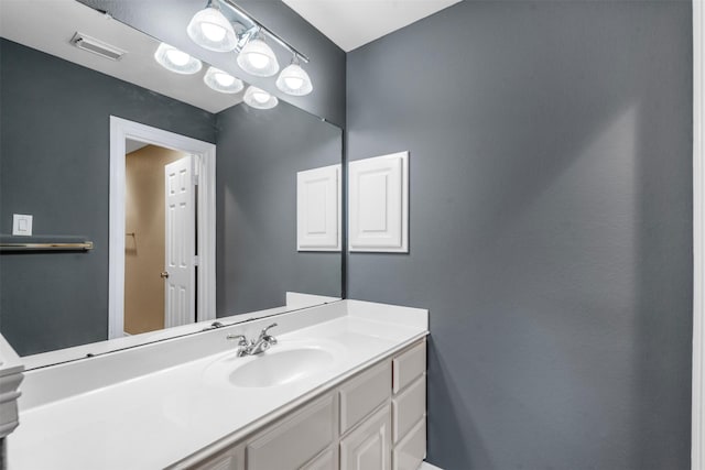 bathroom featuring visible vents and vanity