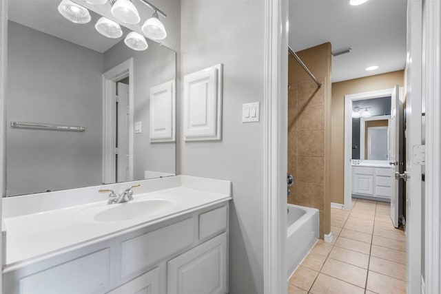 bathroom featuring visible vents, bathing tub / shower combination, vanity, and tile patterned flooring