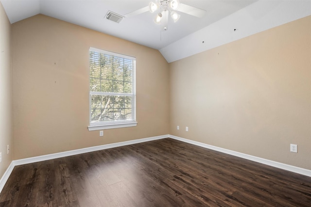 unfurnished room with dark wood-type flooring, baseboards, and vaulted ceiling