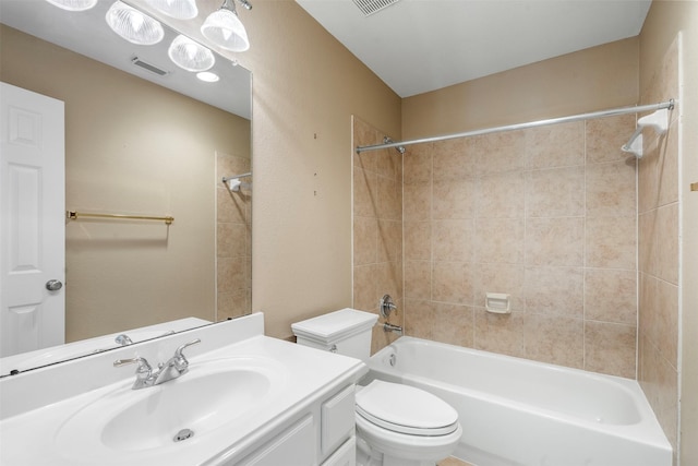 full bathroom featuring visible vents, toilet, vanity, and bathtub / shower combination