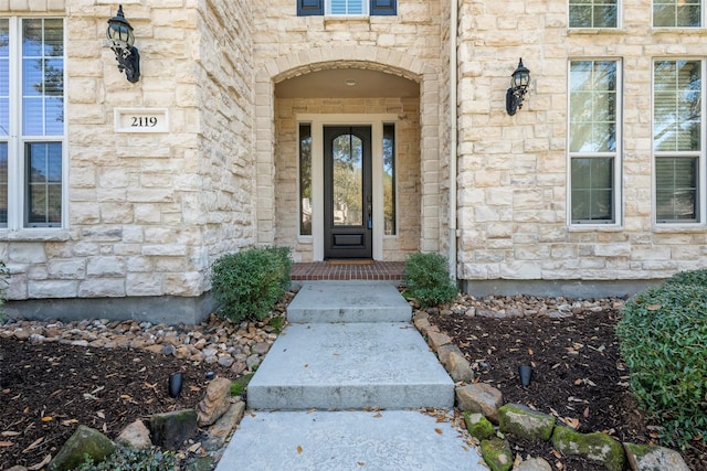 entrance to property with stone siding