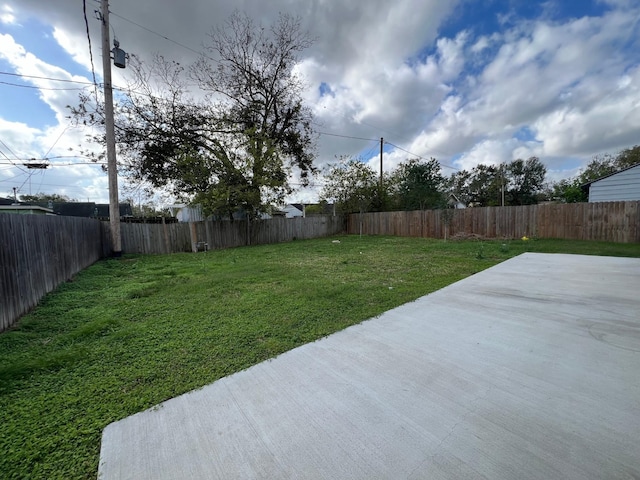 view of yard with a patio area and a fenced backyard