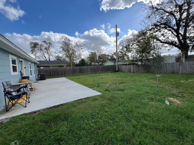 view of yard featuring a patio area and a fenced backyard