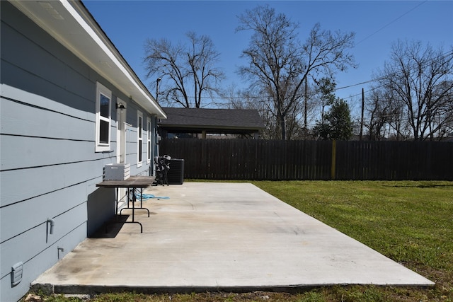 view of patio / terrace featuring central AC unit and fence