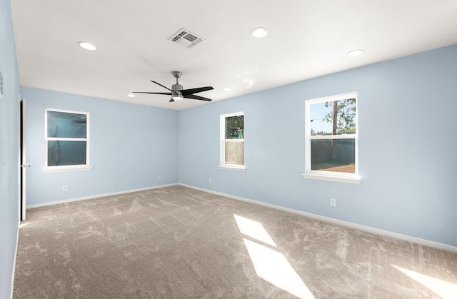 empty room featuring visible vents, baseboards, carpet floors, recessed lighting, and a ceiling fan