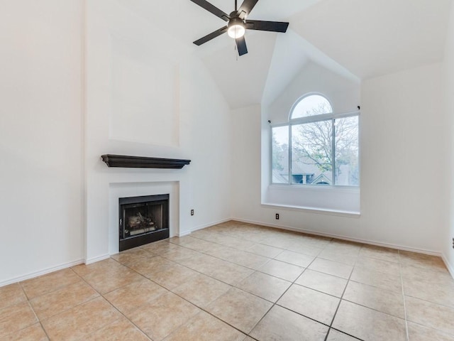 unfurnished living room featuring light tile patterned floors, a ceiling fan, a fireplace, and vaulted ceiling