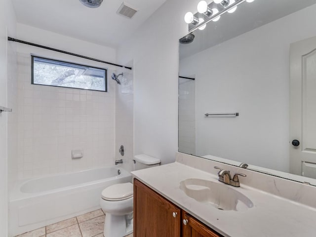 bathroom featuring tile patterned flooring, visible vents, shower / washtub combination, toilet, and vanity