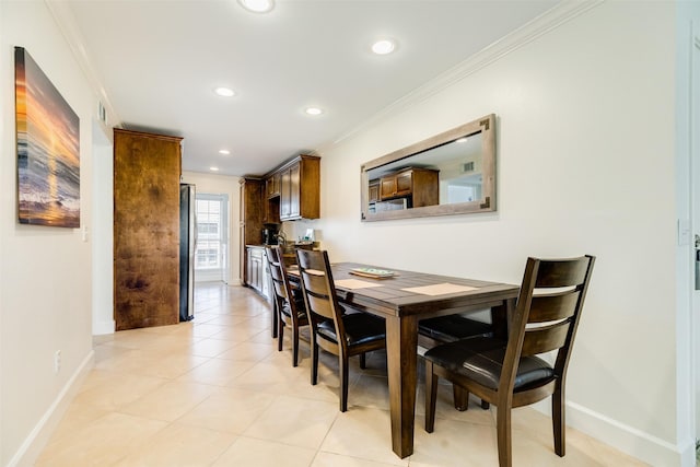 dining space with recessed lighting, baseboards, and ornamental molding