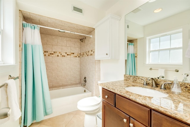 bathroom with tile patterned flooring, visible vents, toilet, shower / tub combo, and vanity