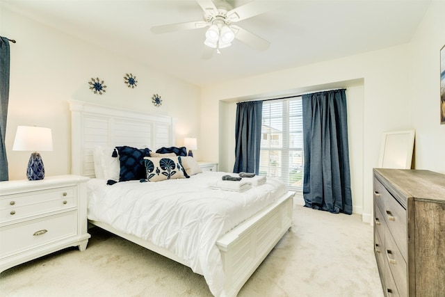 bedroom with light colored carpet and ceiling fan