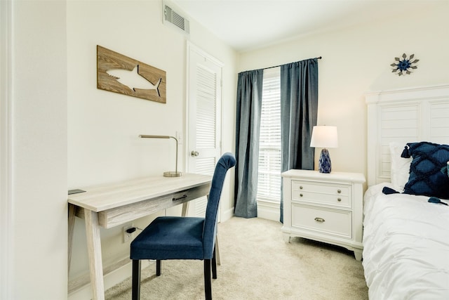 home office with visible vents and light carpet