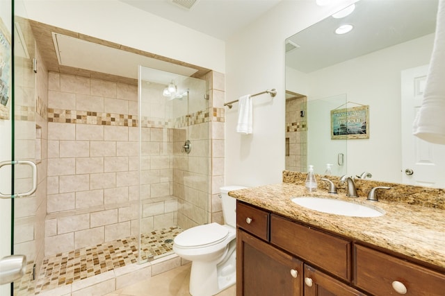 full bathroom featuring visible vents, a shower stall, toilet, and vanity