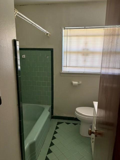 bathroom featuring tile patterned floors, toilet, and vanity