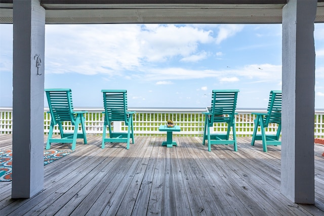 wooden deck featuring a water view