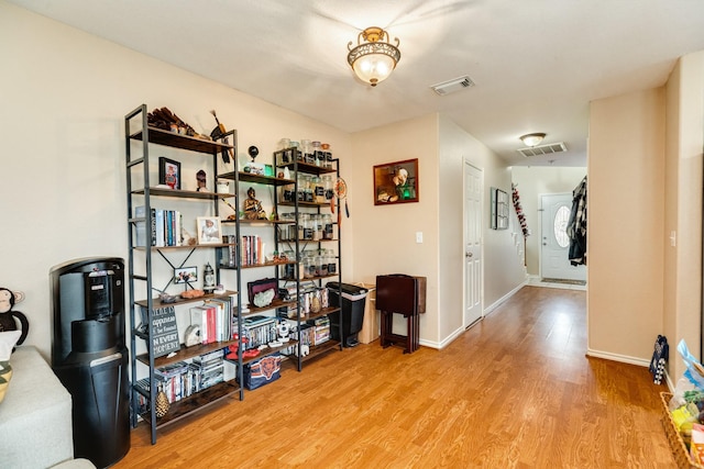 interior space with visible vents, baseboards, and light wood-style floors