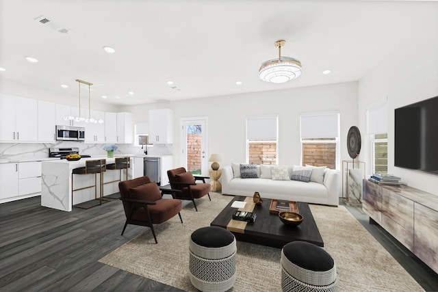 living area with recessed lighting and dark wood-style flooring