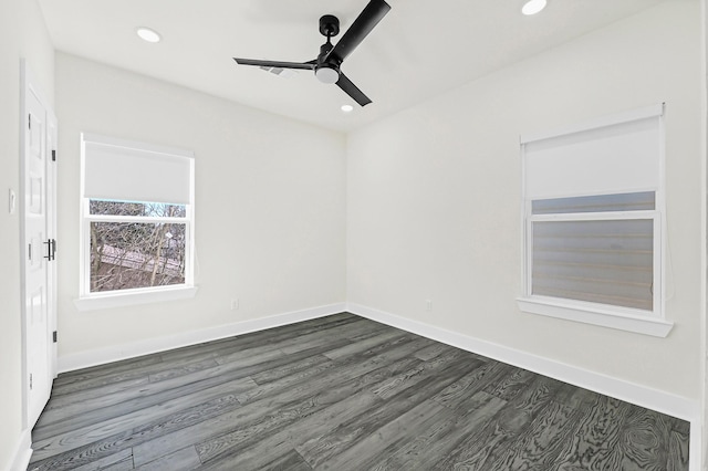 spare room with dark wood-type flooring, recessed lighting, baseboards, and ceiling fan