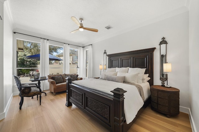 bedroom with visible vents, a ceiling fan, light wood-type flooring, and baseboards